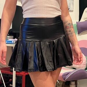 Faux leather pleated skirt.